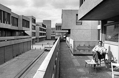 Thamesmead, Greenwich, London: a resident relaxing on his balcony. © Tony Ray-Jones / RIBA Library Photographs Collection