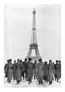 Hitler and the Nazis in front of the Eiffel Tower.