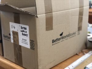 Cardboard box with the Better World Book logo on it.